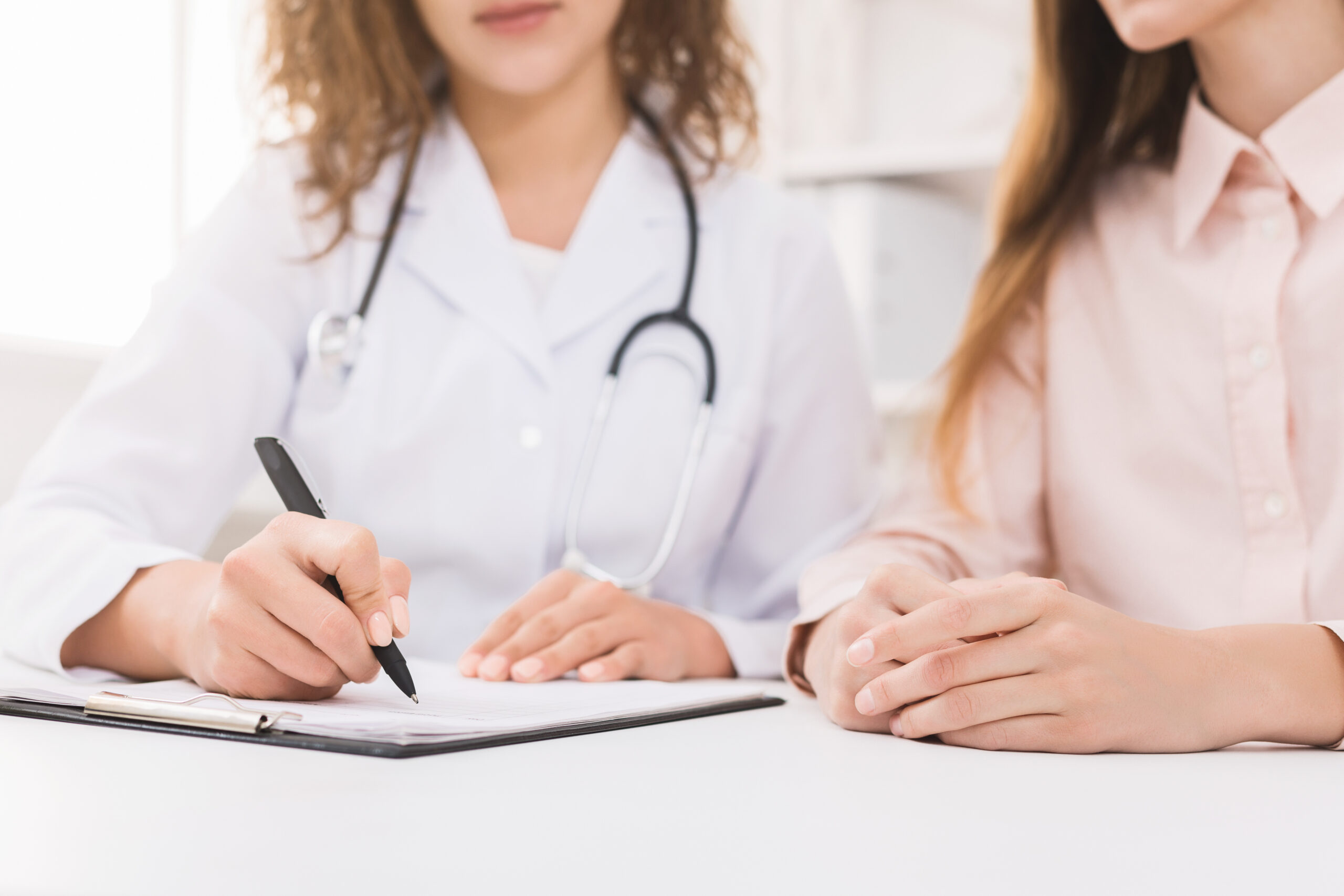 Physician reviewing a weight-loss plan with a patient