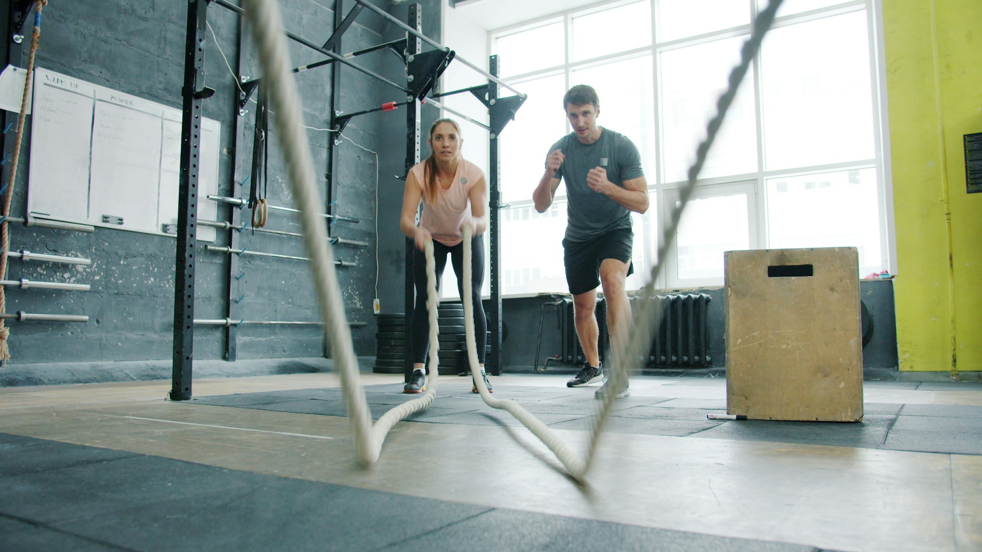 Two people working out together in a gym